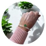 Veterarmband wit met groen klavertje goud