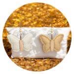 Warm vlindertje zand en wit