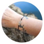 Zwarte veterarmband met klavertje